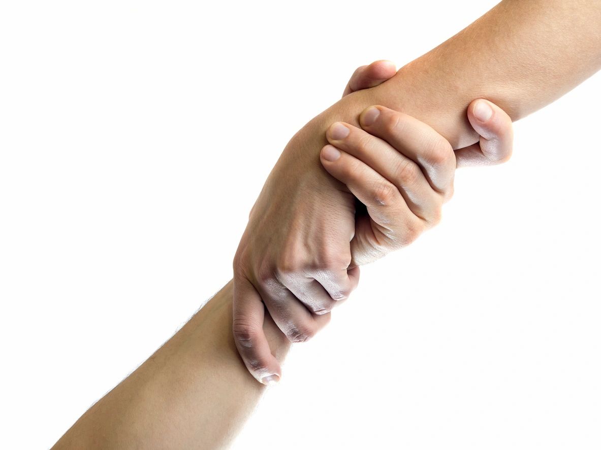 Hands clasped together in support