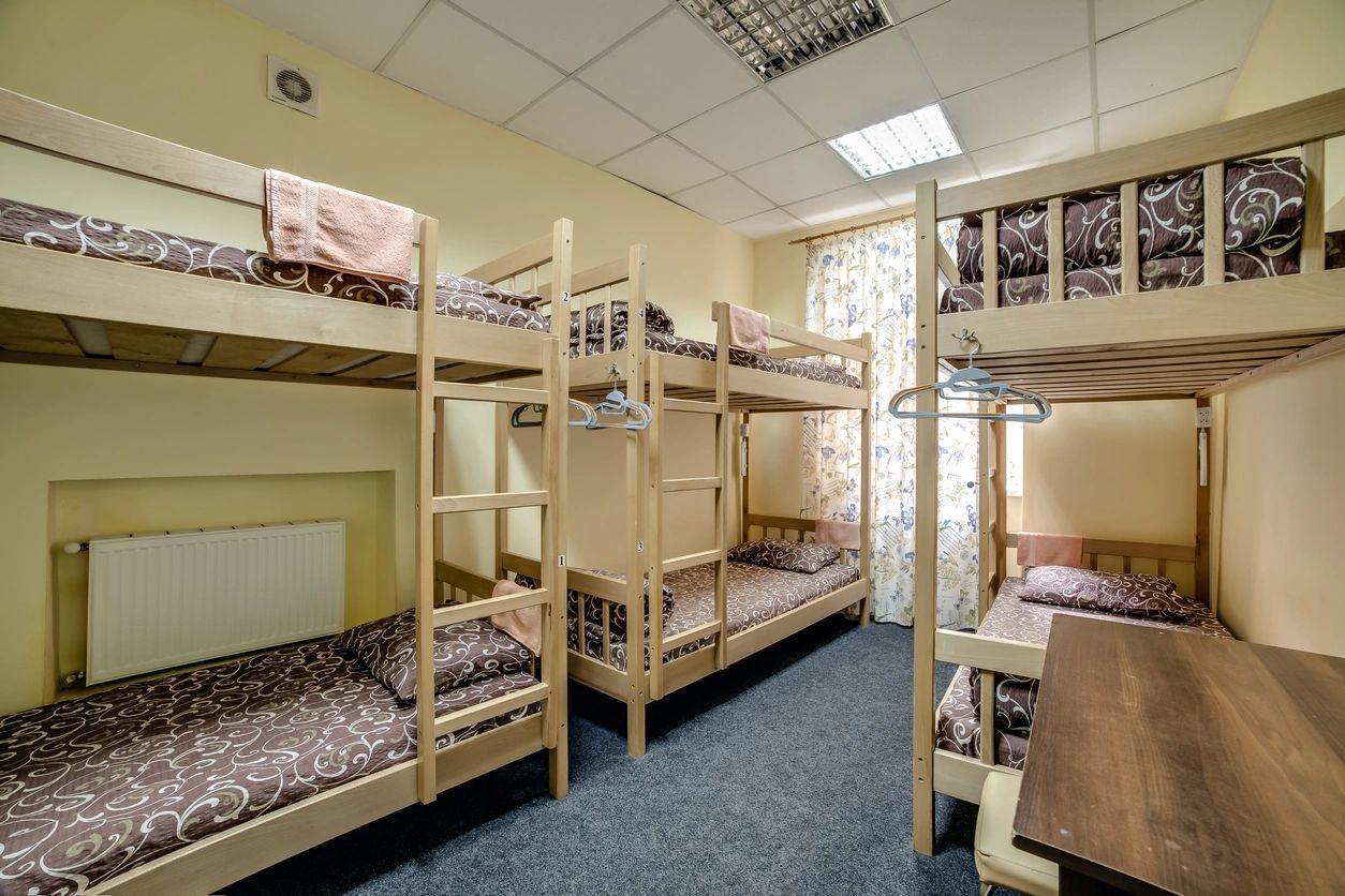 Clean dormitory shelter room with bunk beds