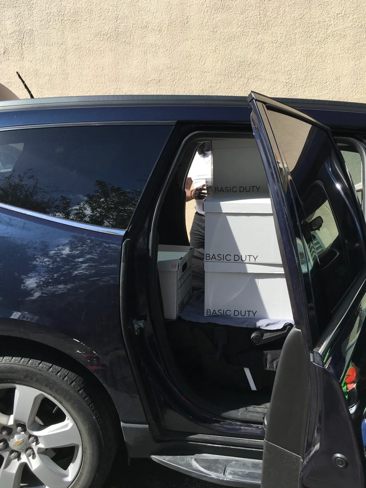 Basic Duty boxes being loaded into vehicle interior