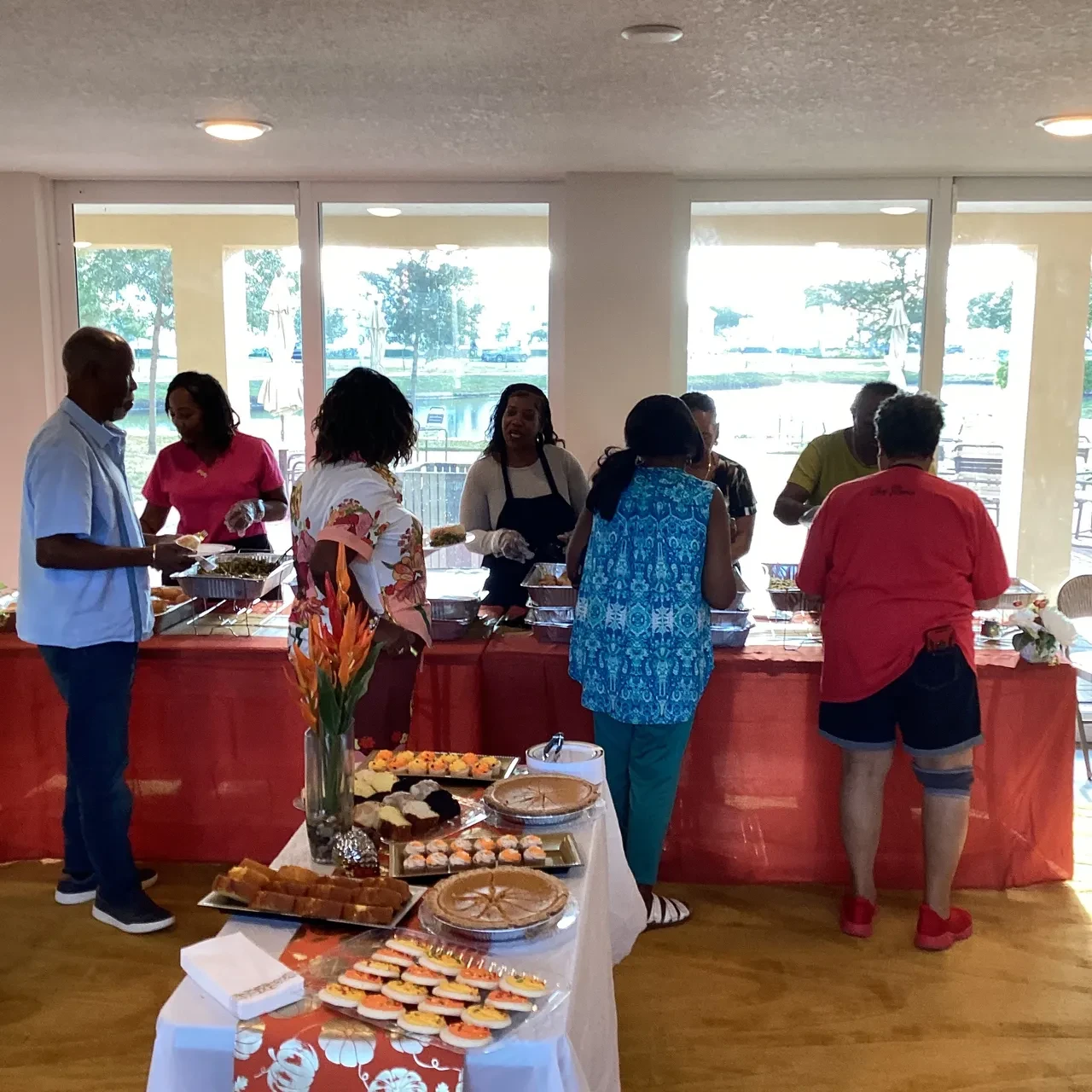 Volunteers and guests at indoor holiday buffet service